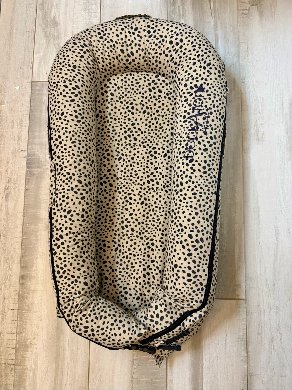 DockATot Deluxe+ Infant Lounger in Cream with Black Spots